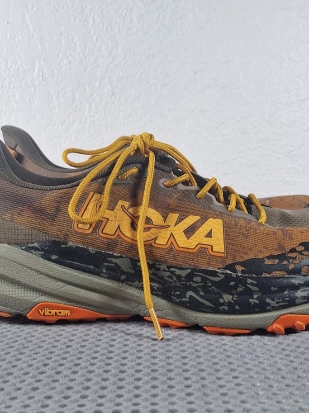 Hoka One Speedgoat 6 trail running shoes in the Antique Olive/Squash Size 10